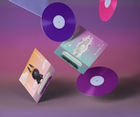 a purple, pink, and blue vinyl lying on top of a purple background